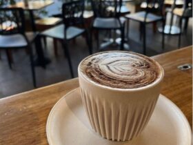 delicious looking cappachino on a wooden table