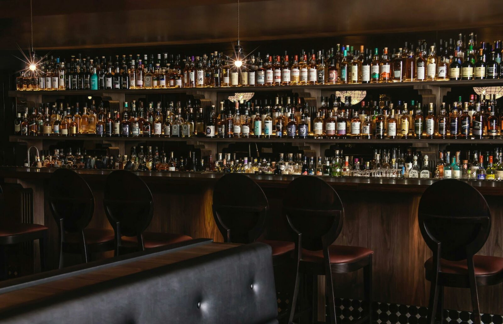A bar filled with hundreds of whisky bottles