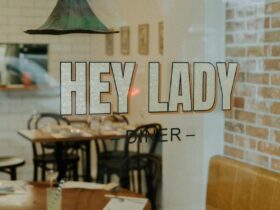 A view of the diner through the front window with Hey Lady text