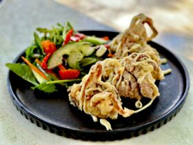 Deep Fried, Lightly Battered Soft Shell Crab drizzled in Japanese Mayo, served with a Salad