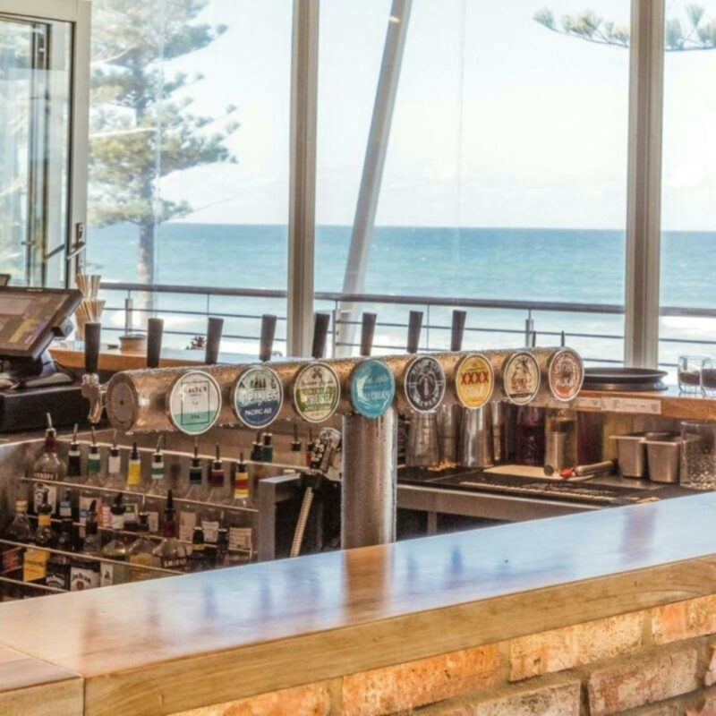 View of the ocean over the bar taps