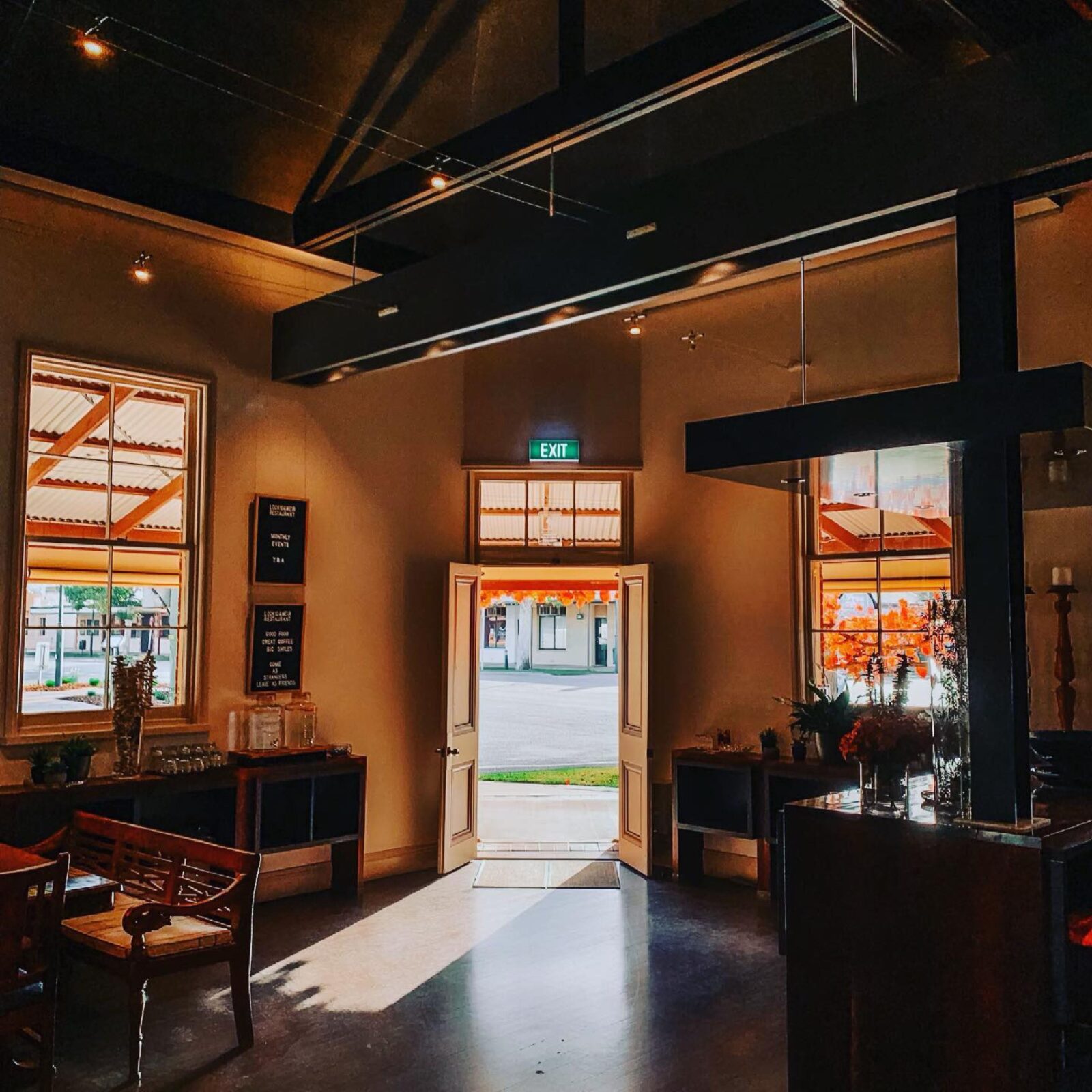 Cafe interior sun streaming through doors