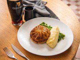 Beef and Guinness pie with mushy peas and red wine jus