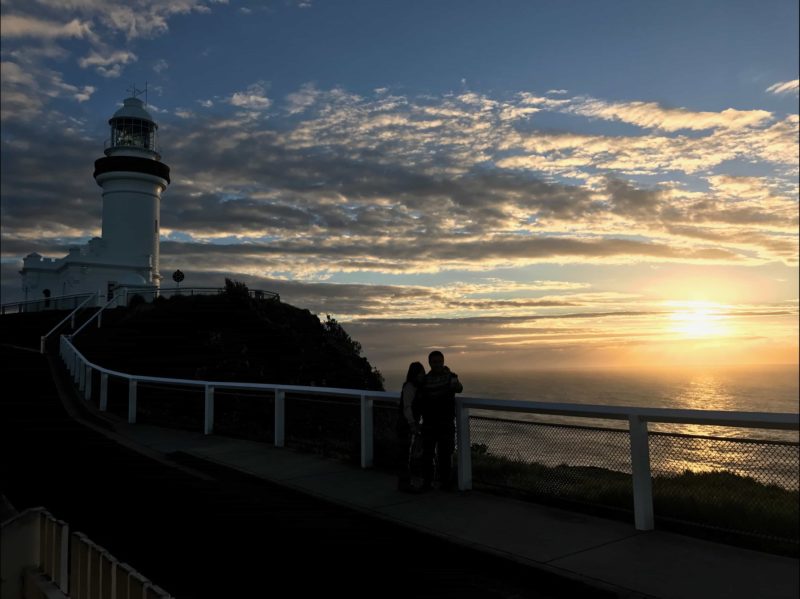 A couple enjoying a private moment watching Australia's first mainland sunrise at Cape Byron
