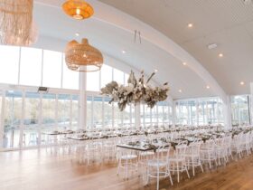 Light, bright wedding venue reception area by the water