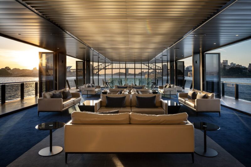 middle deck with beige sofas and sunset