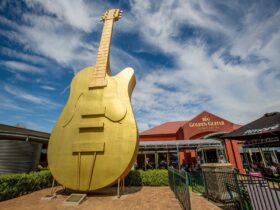 Photo of Big Golden Guitar with the Information Centre entrance