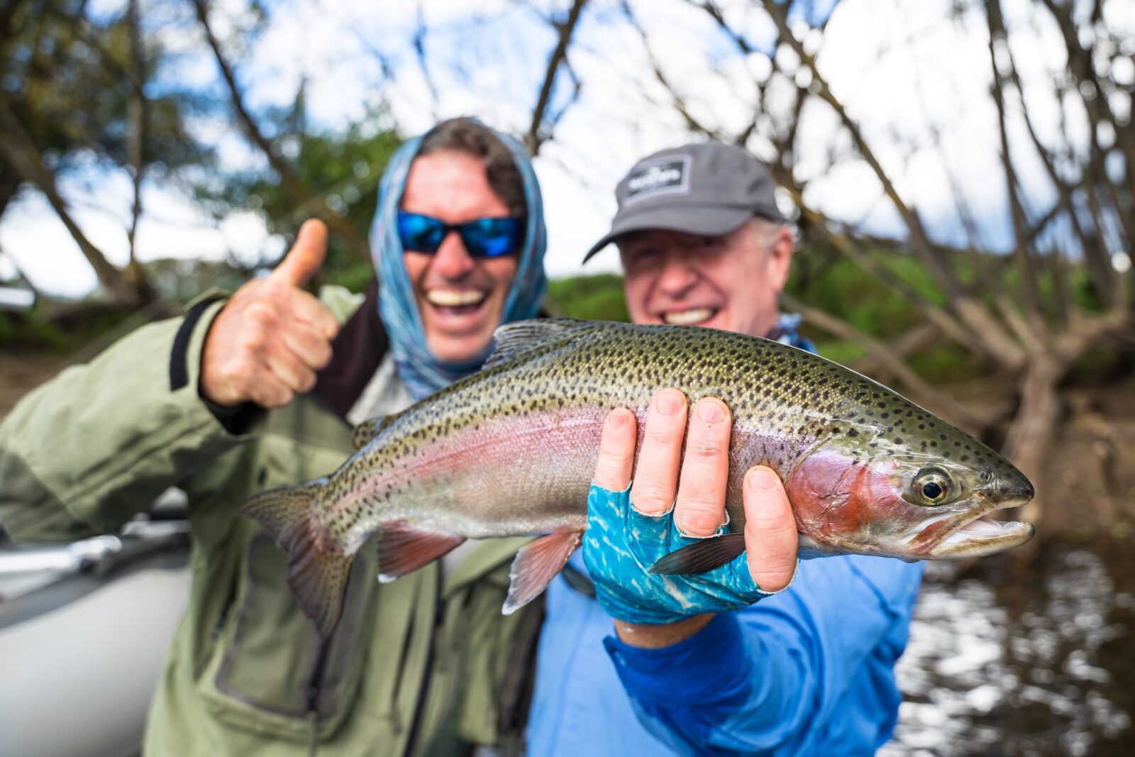 Two excited men with fish