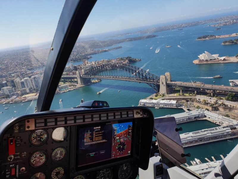 Helicopter cockpit photo about to fly over the Sydney Harbour Bridge