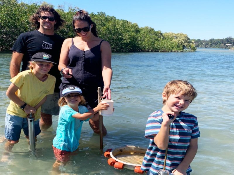 Young family pumping for yabbbies on Catch a Crab tour of Tweed River