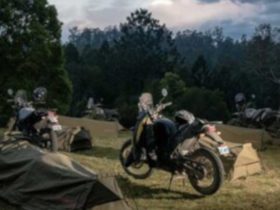 campsite on dusk with tents up and motorcycles