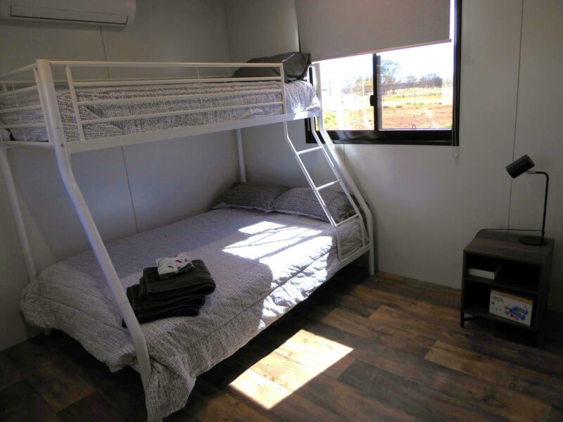 Single bed over double bunk