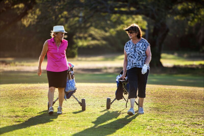 Lovely ladies playing a game at gardens park golf links