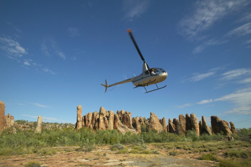 A helicopter takes off from the Lost City in Limmen National Park