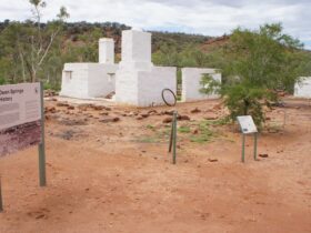 Old Owen Springs Homestead site, showing some interpretive signage and wire fencing around buildings