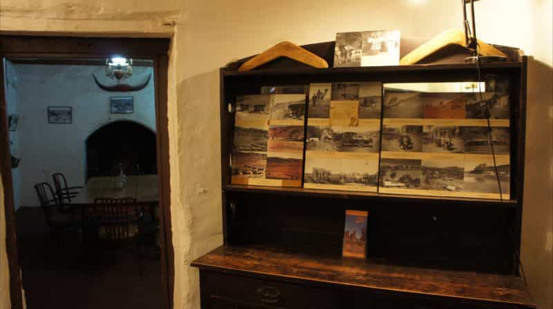 General view of interior of old homestead building, furnished in period pieces, and displays of hand-made interpretive material.