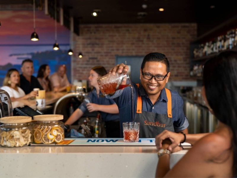 A staff member mixes a delicious cocktail at the Sandbar in Mindil Beach Casino Resort