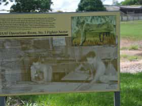 Interpretative signage at the site. A small circular brass plaque indicating the site is on the NT Heritage Register has been removed from the site.