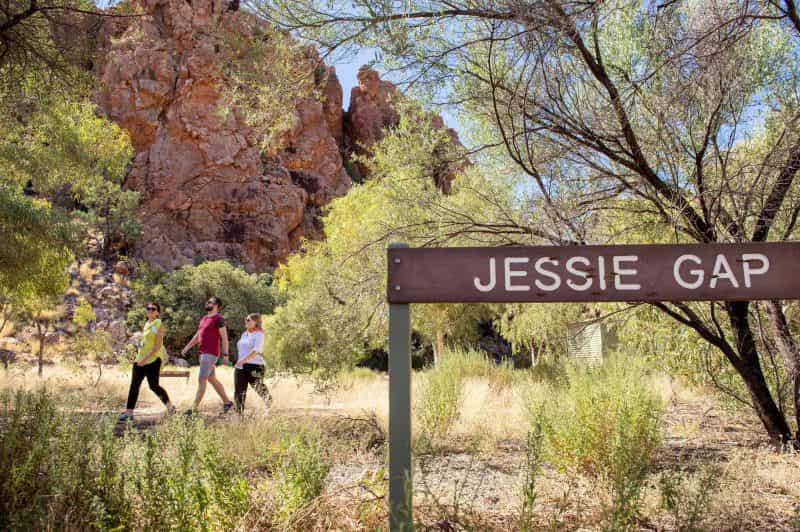 Visitors walking past a sign saying Jessie Gap