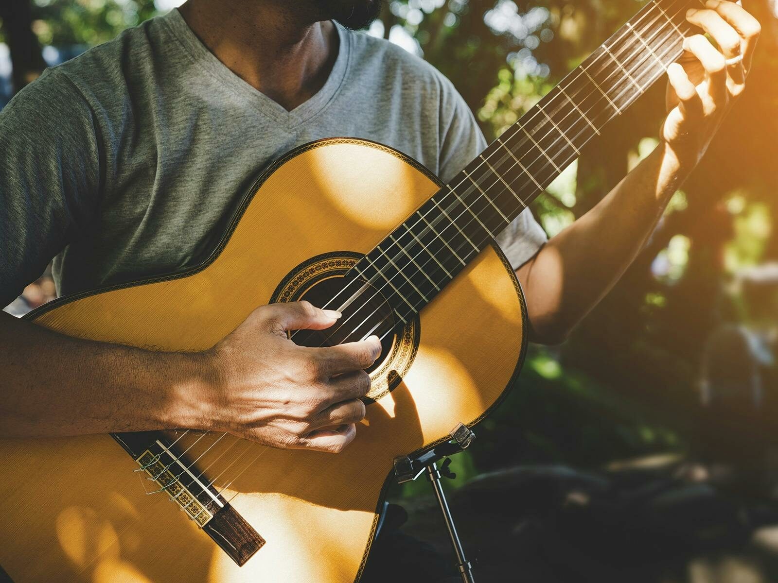 Photograph of someone holding a guitar