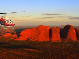 Helicopter flying over the western side of the Kata-Tjuta at sunset.