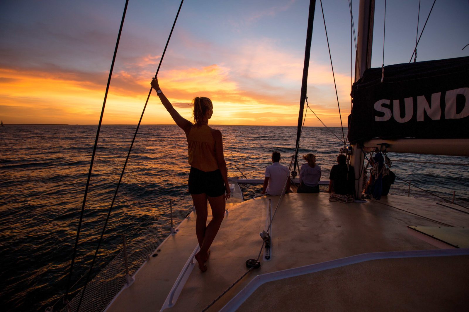 Sundancer NT Sailing towards a tropical sunset
