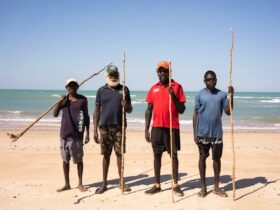 us mob men with mangrove sticks