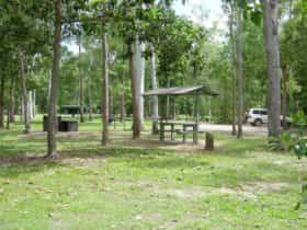 Barbeques and picnic shelters at day use area near camping area.