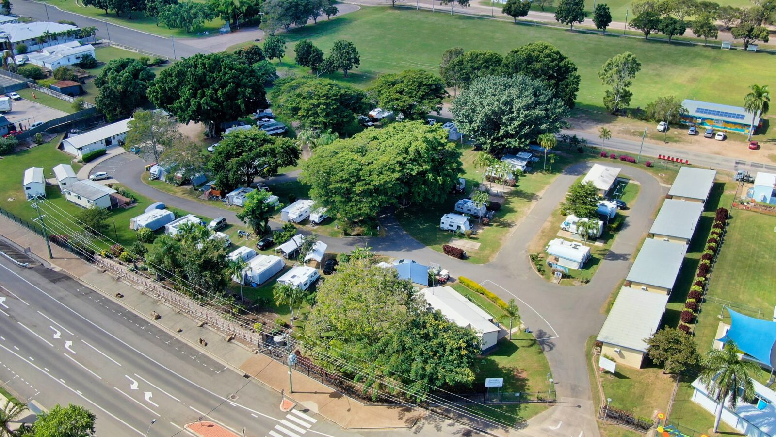 Aerial picture shows caravan park layout and the tree coverage.