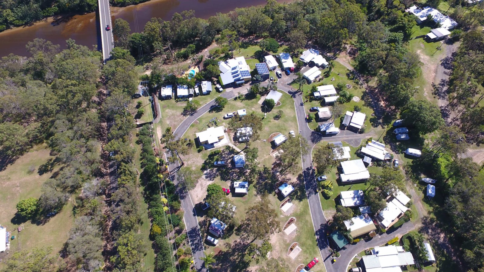 Aerial photo of Burrum River Caravan Park showing location beside the Burrum River bridge.