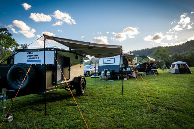 Campervan, caravan and tent set up at the Kerry Valley Secret campsite