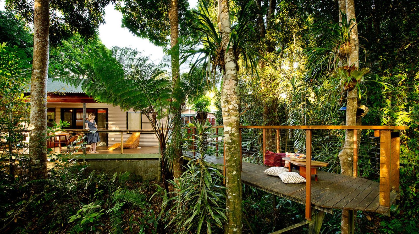 alt="Veranda and walkway leads into the rain forest overlooking the river at Sharlynn"