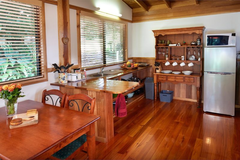 alt="Fully self-contained kitchen and dining area at Sharlynn by the River"