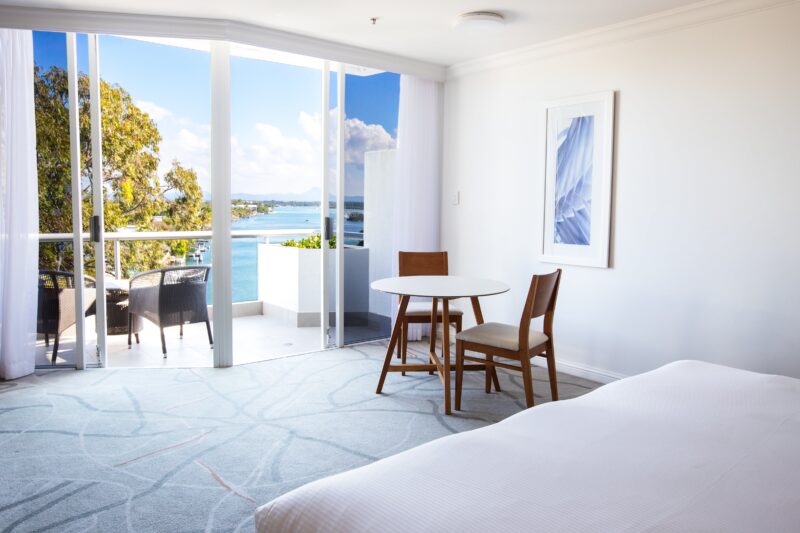 River View hotel room with balcony and seating area,overlooks Noosa River