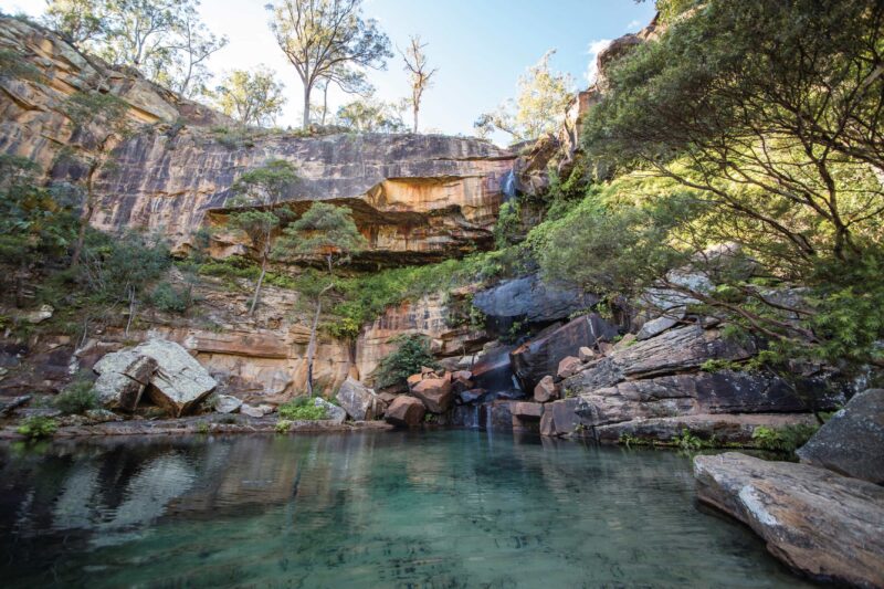 Clear waters of creek and sandstone escaprment.