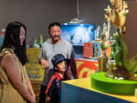 Family viewing 'Tom Moore: Abundant Wonder' exhibition