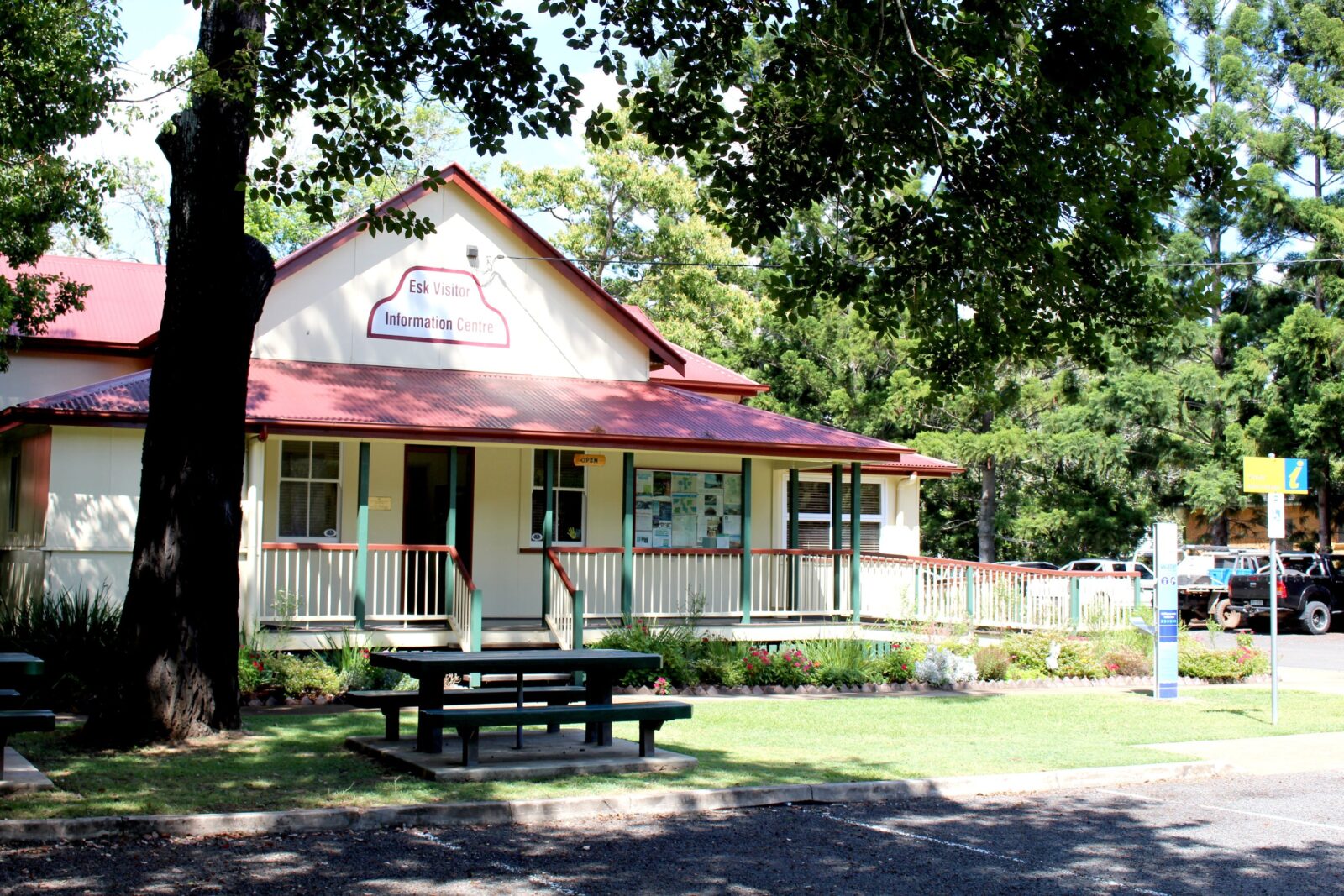 External View of the Esk Visitor Information Centre - older building with wrap verandah, trees