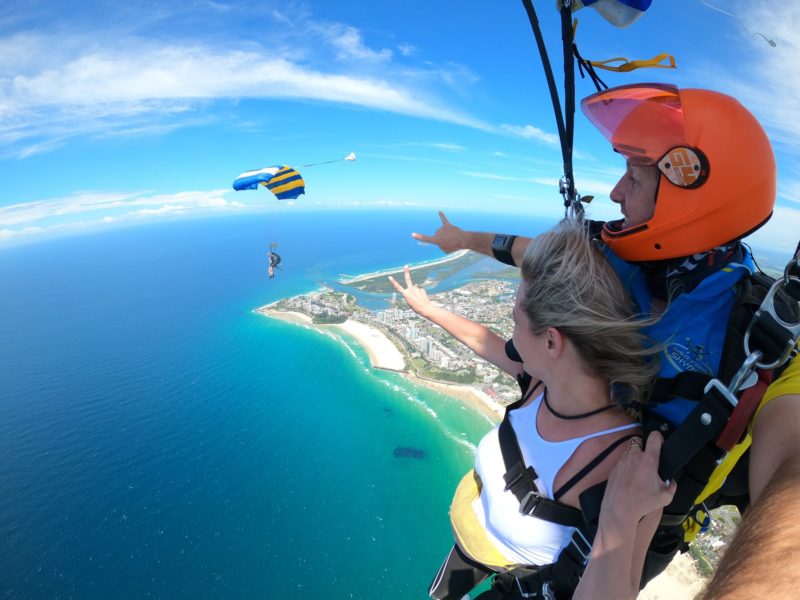 Tandem skydive under canopy coming to land Gold Coast beach