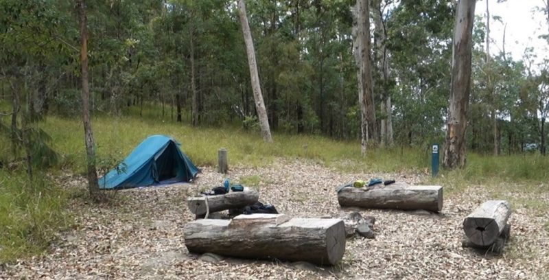 A tent and campfire area in Middle Kobble Creek Camping