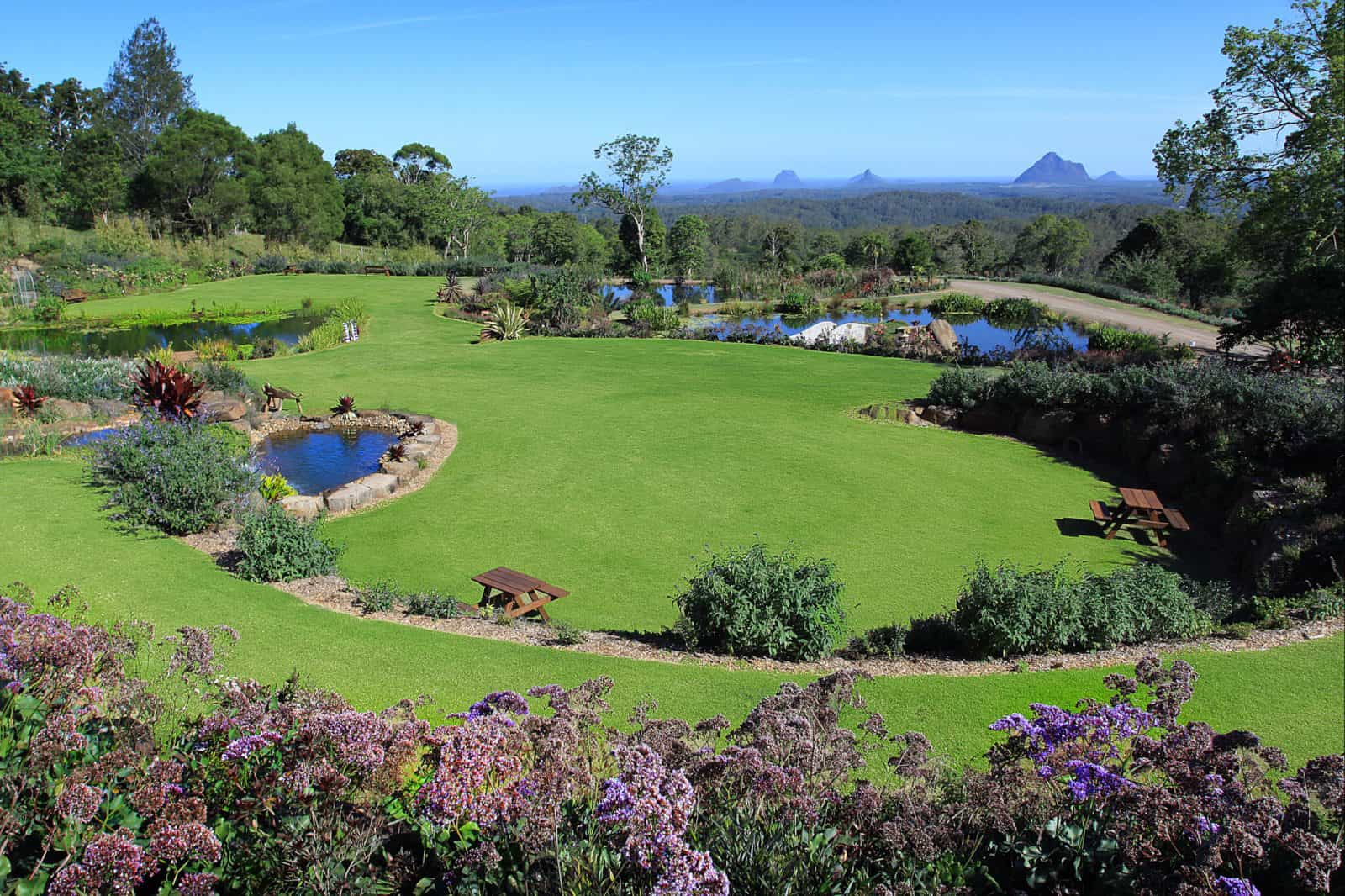 Waterfalls, ponds and stunning Glasshouse Mountain views create an awesome experience