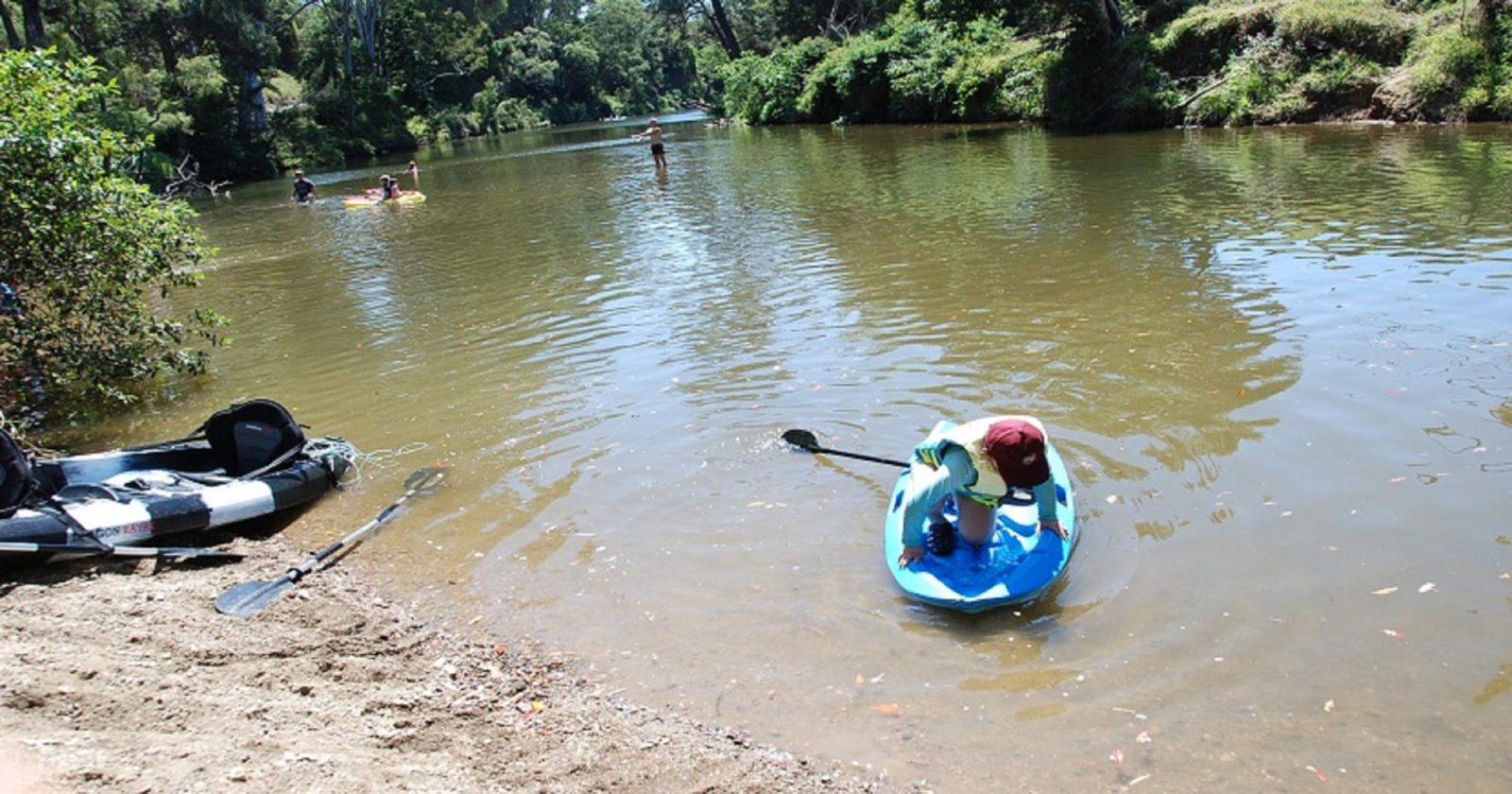A number of people playing in the water at Neurum Creek, near the campgrounds