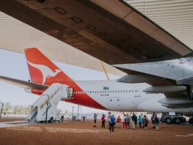 Image captured by Tourism & Events Queensland of an airpark tour taking place under the 747 wing.