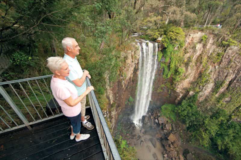 Older couple at lookout over falls.