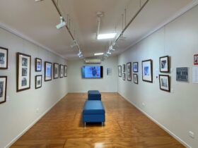 Gallery with framed photos on the walls