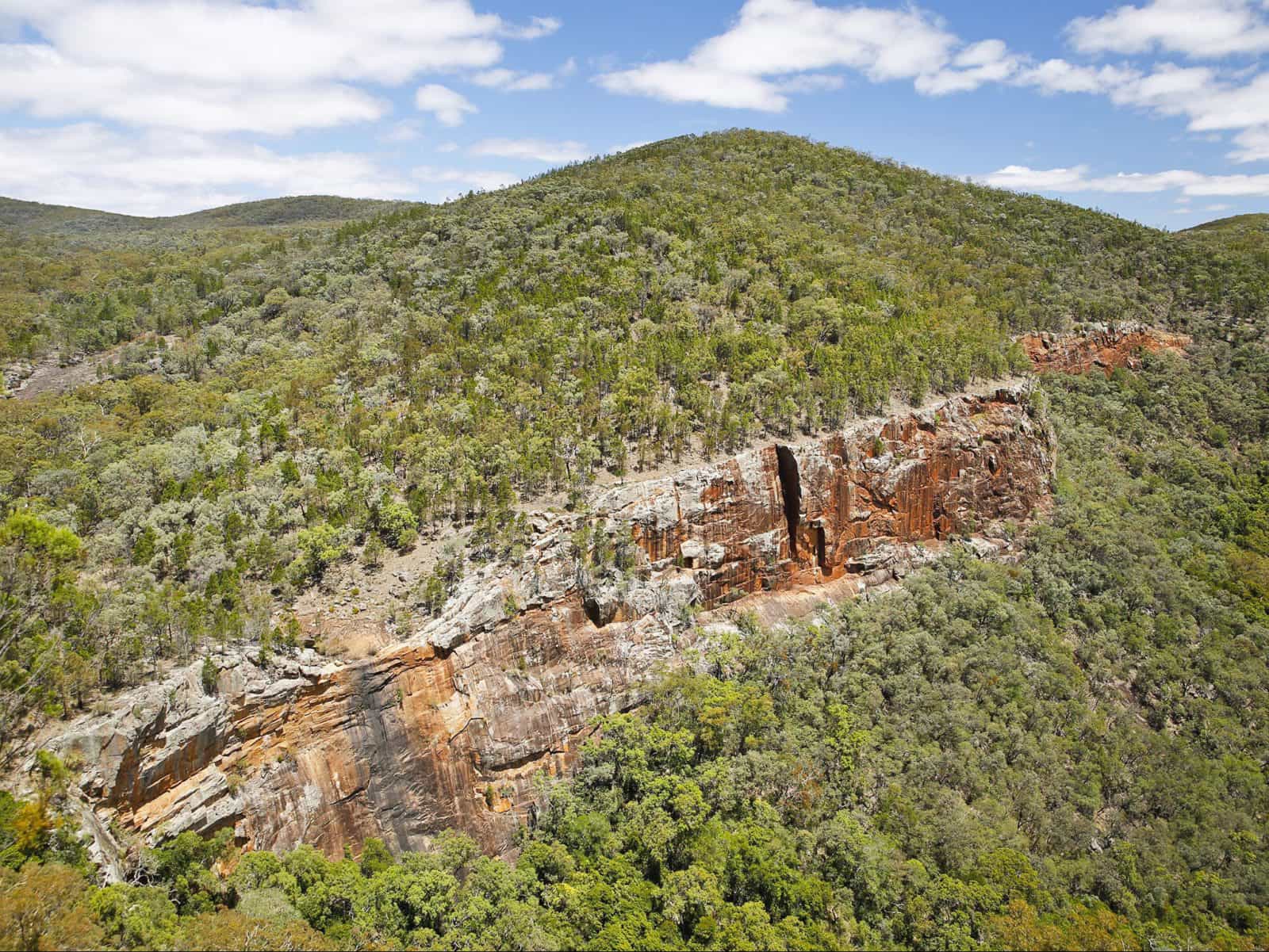 View of gorge and red, treeless cliff faces.