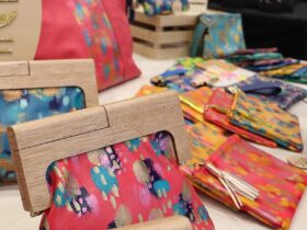 Handpainted leather handbags with wooden handles, at the what we make design market