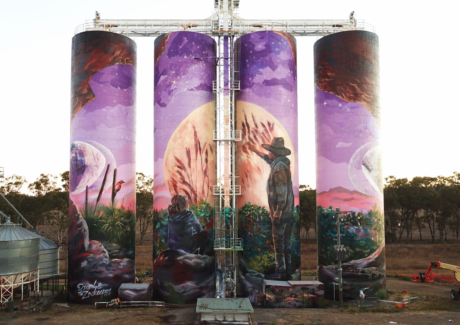 image of the three moon grain silo at day time
