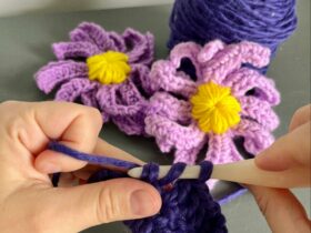 A person crocheting flowers