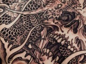 Photo of back dragon tattoo close up with lots of detail, black ink