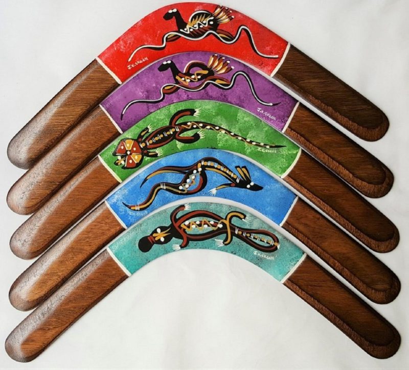 Colorful hand painted contemporary animal designs on Aboriginal wooden returning boomerangs;